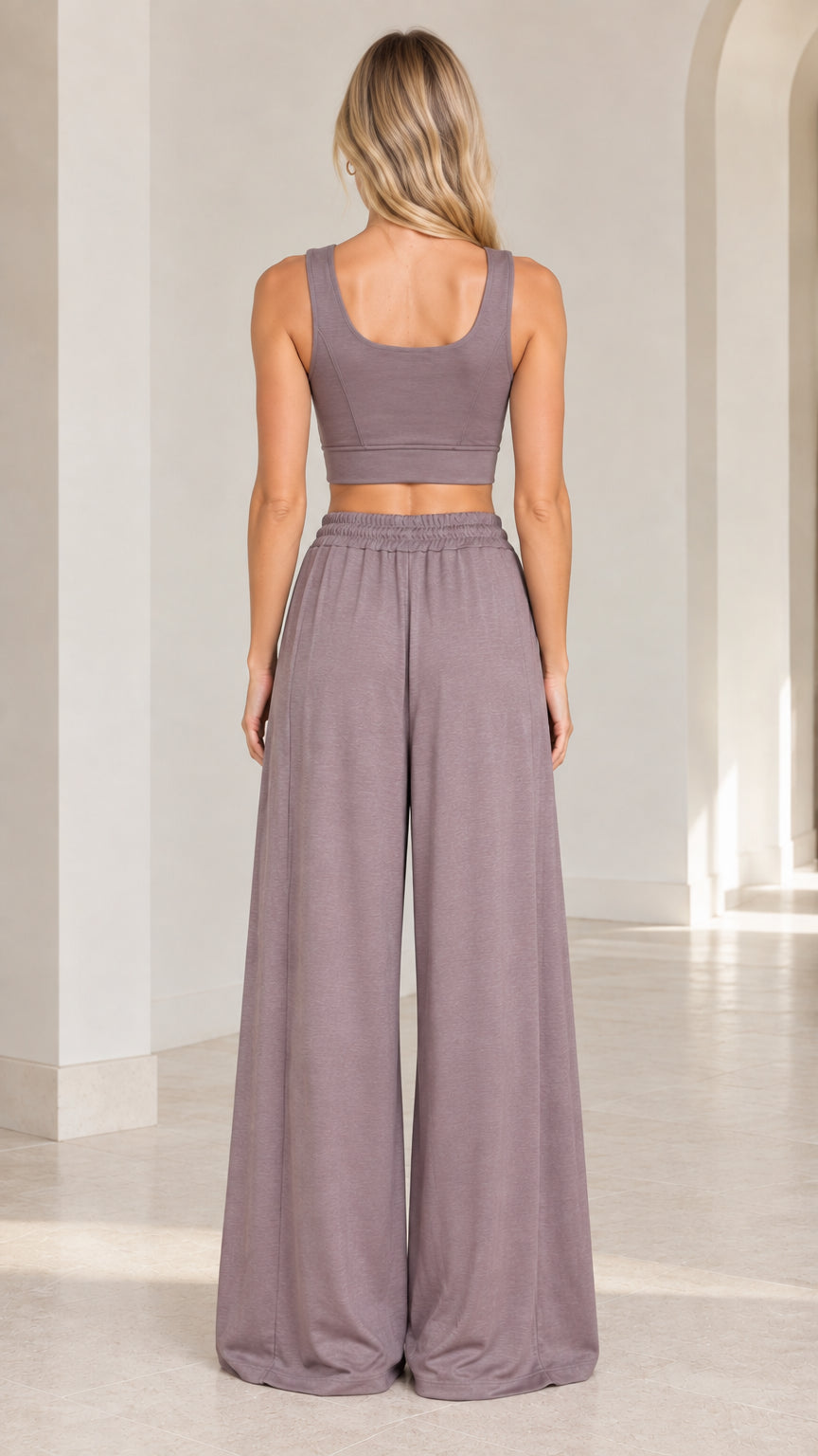 Back view of woman wearing Dusty Mauve sleeveless crop top and wide-leg pants
