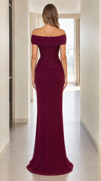 Back view of woman wearing burgundy off-the-shoulder formal maxi dress