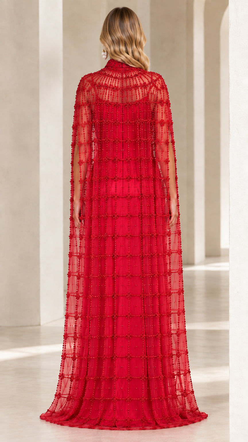 Back view of floor-length red beaded cape formal dress