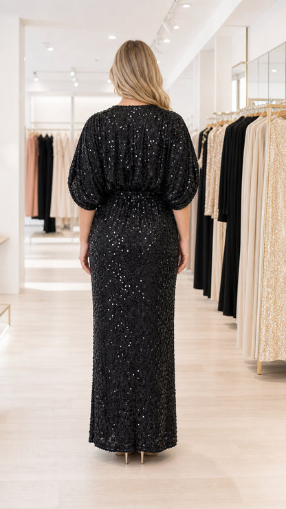 Back view of black sequin maxi gown showing blouson bodice and fitted skirt