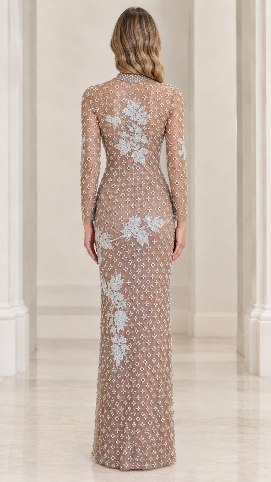 Back view of champagne long sleeve formal evening gown with all-over beading