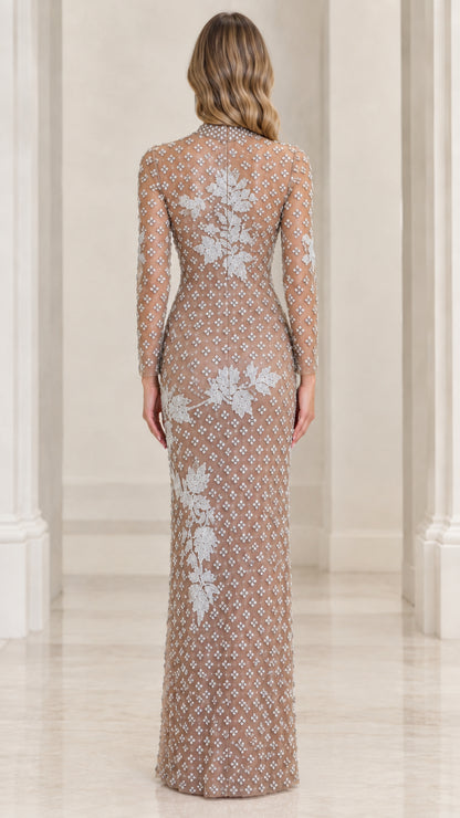 Back view of champagne long sleeve formal evening gown with all-over beading