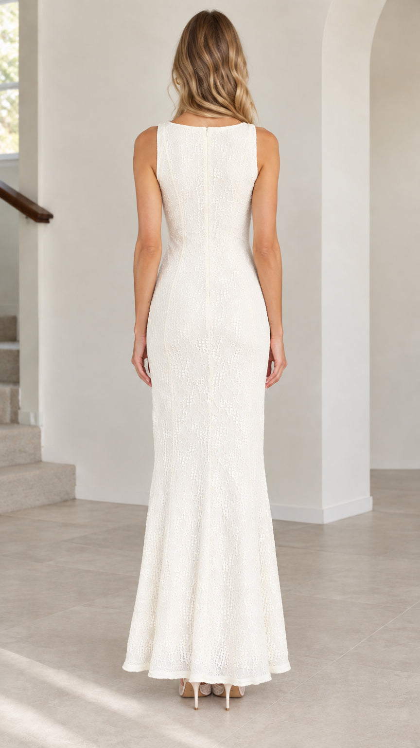 Back view of model wearing floor-length ivory lace evening dress