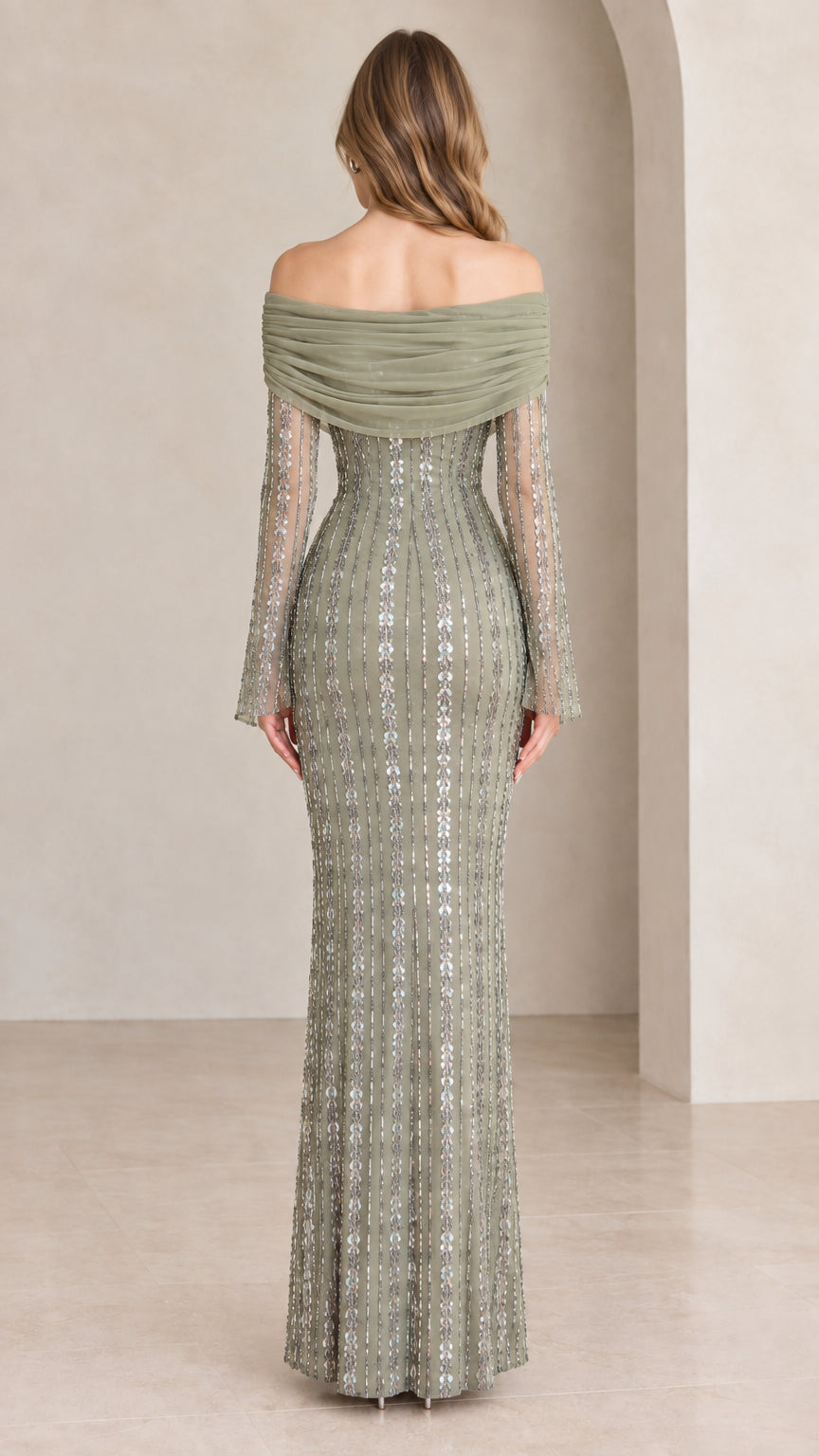 Back view of model showcasing draped back neckline and sequin detailing
