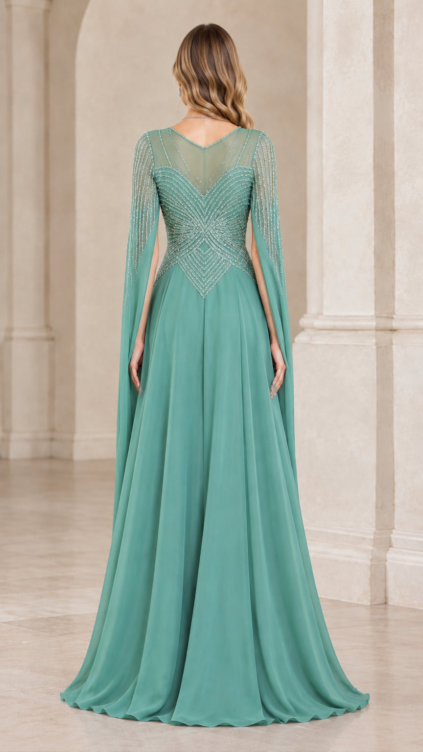 Back view of sage green evening dress showing illusion mesh back and capelet drape