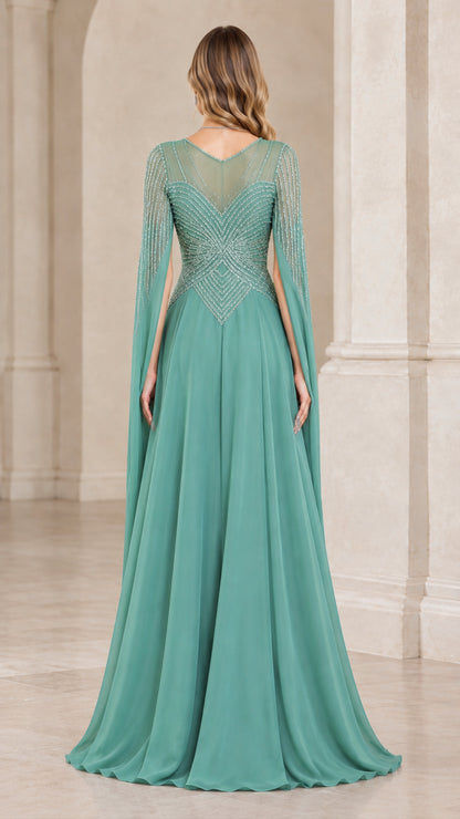 Back view of sage green evening dress showing illusion mesh back and capelet drape