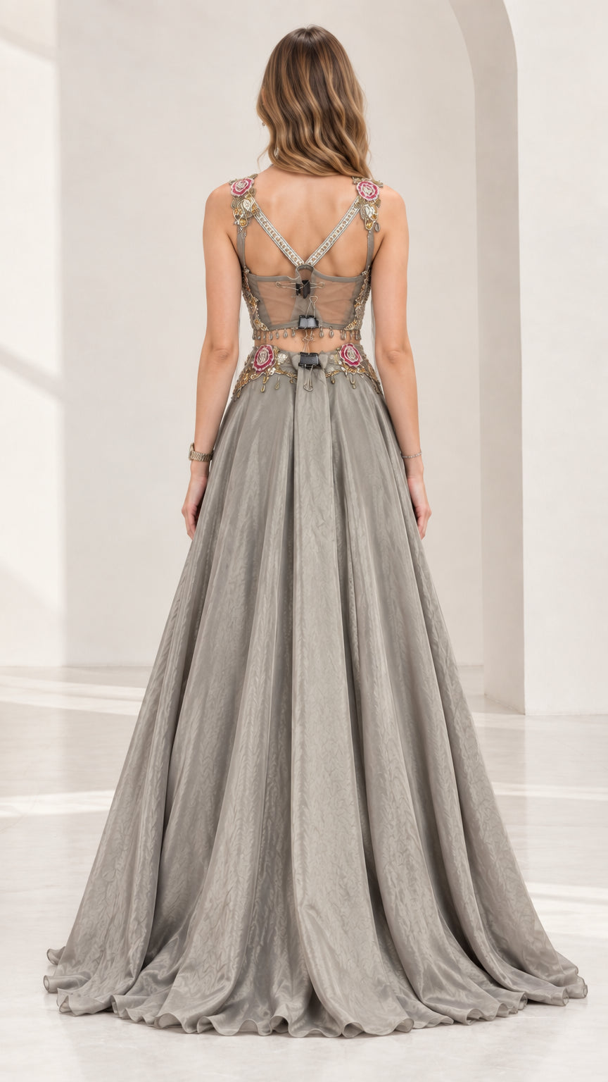 Back view of silver grey evening set showing illusion mesh back and zipper detail