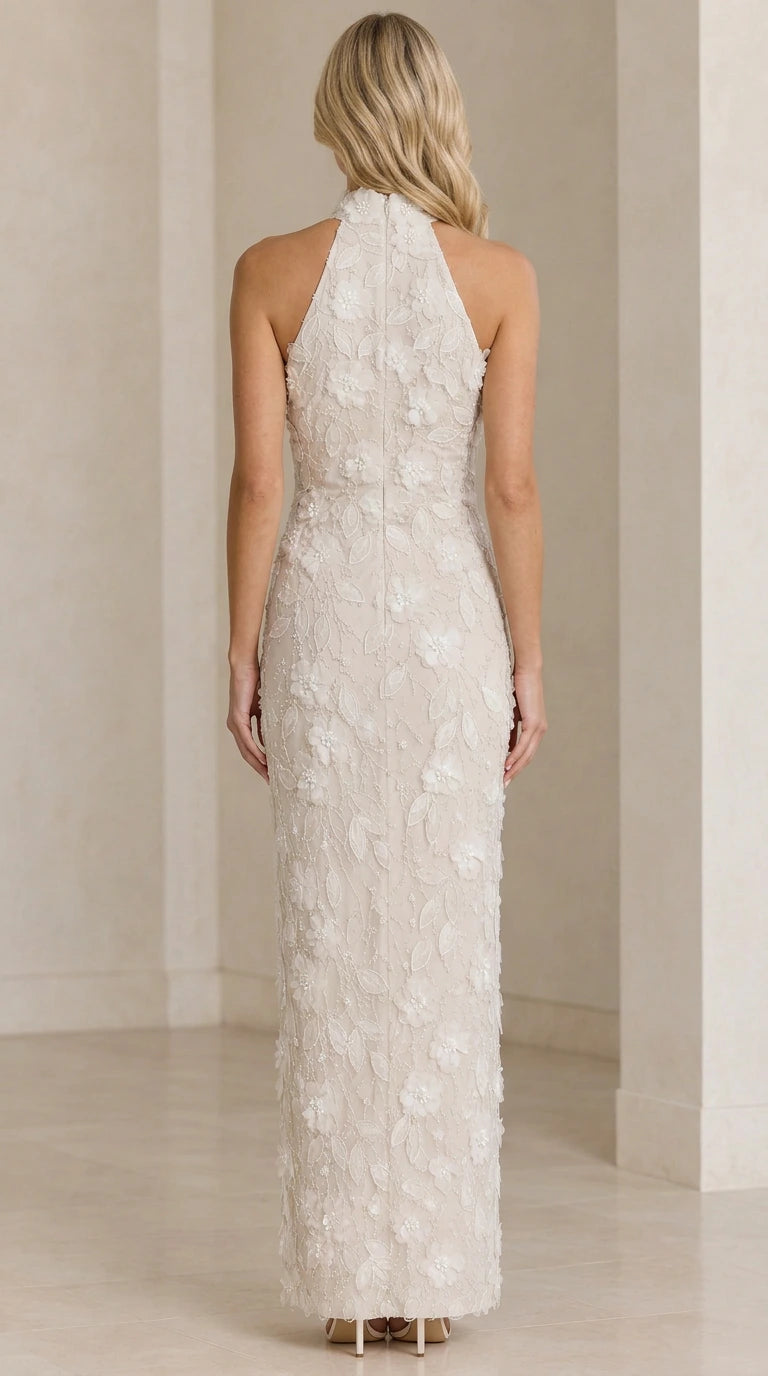 Back view of Ivory floor-length sleeveless halter gown with floral embroidery
