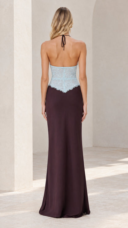 Back view of model showing open back and tie-neck closure on halter gown
