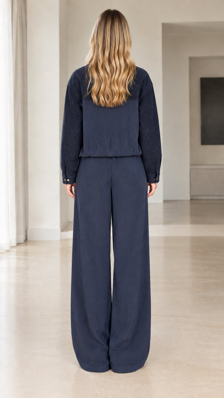 Back view of navy two-piece loungewear set featuring wide-leg pants
