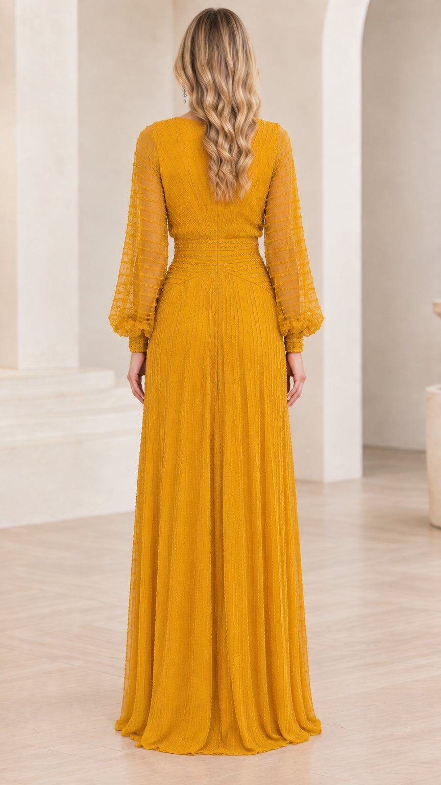 Back view of mustard yellow long sleeve pleated formal gown