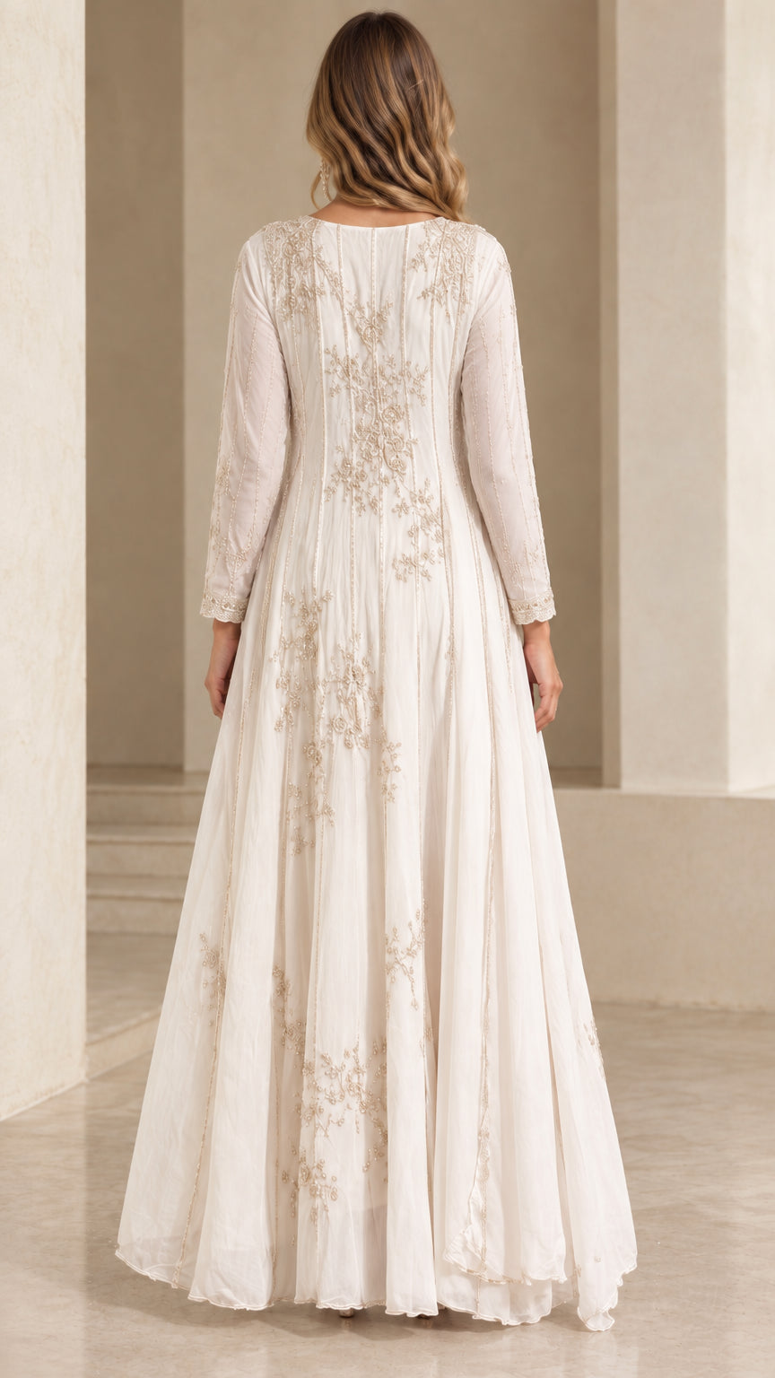 Back view of white embroidered flowing evening dress