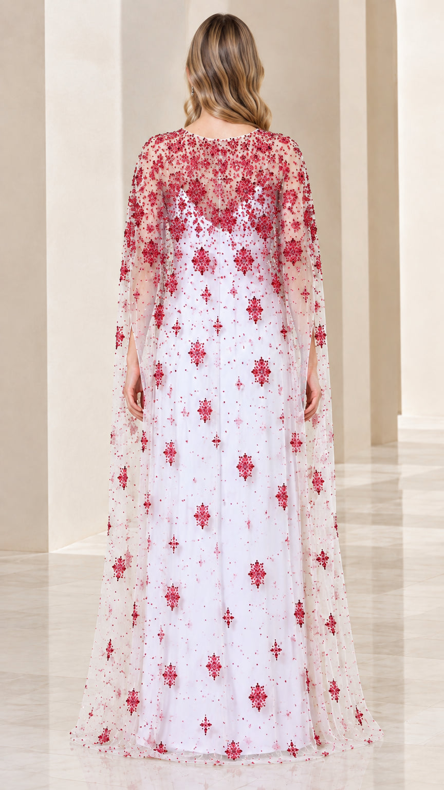White cape formal gown with floral red embroidery back view