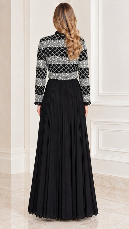 Back view of black sequined long sleeve pleated maxi dress