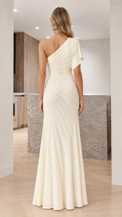Back view of woman in ivory one-shoulder pleated formal gown