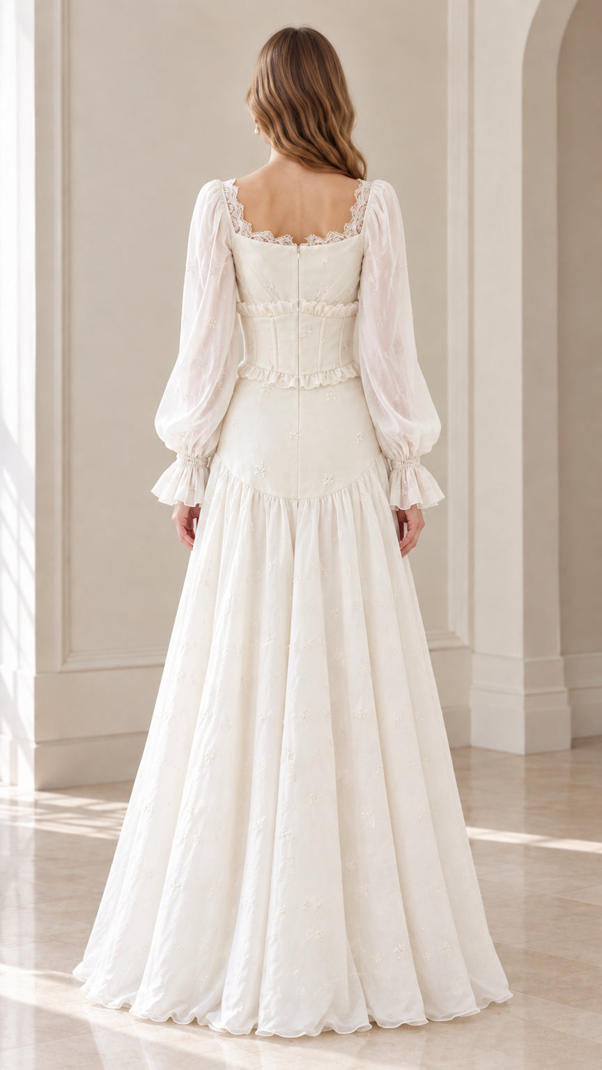 Back view of model in ivory corset-style floor-length dress