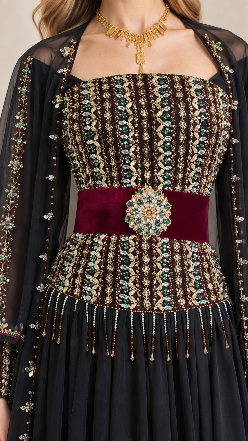 Close-up of intricate beaded bodice and velvet brooch waistband