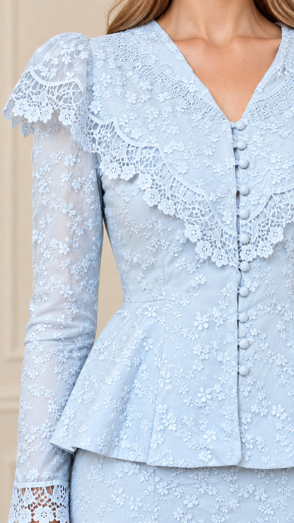 Close-up of Light Blue floral lace detailing, ruffled collar, and covered buttons