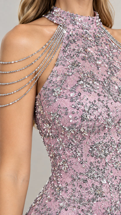 Close-up detail of high collar and draped crystal shoulder chains on pink sequin dress