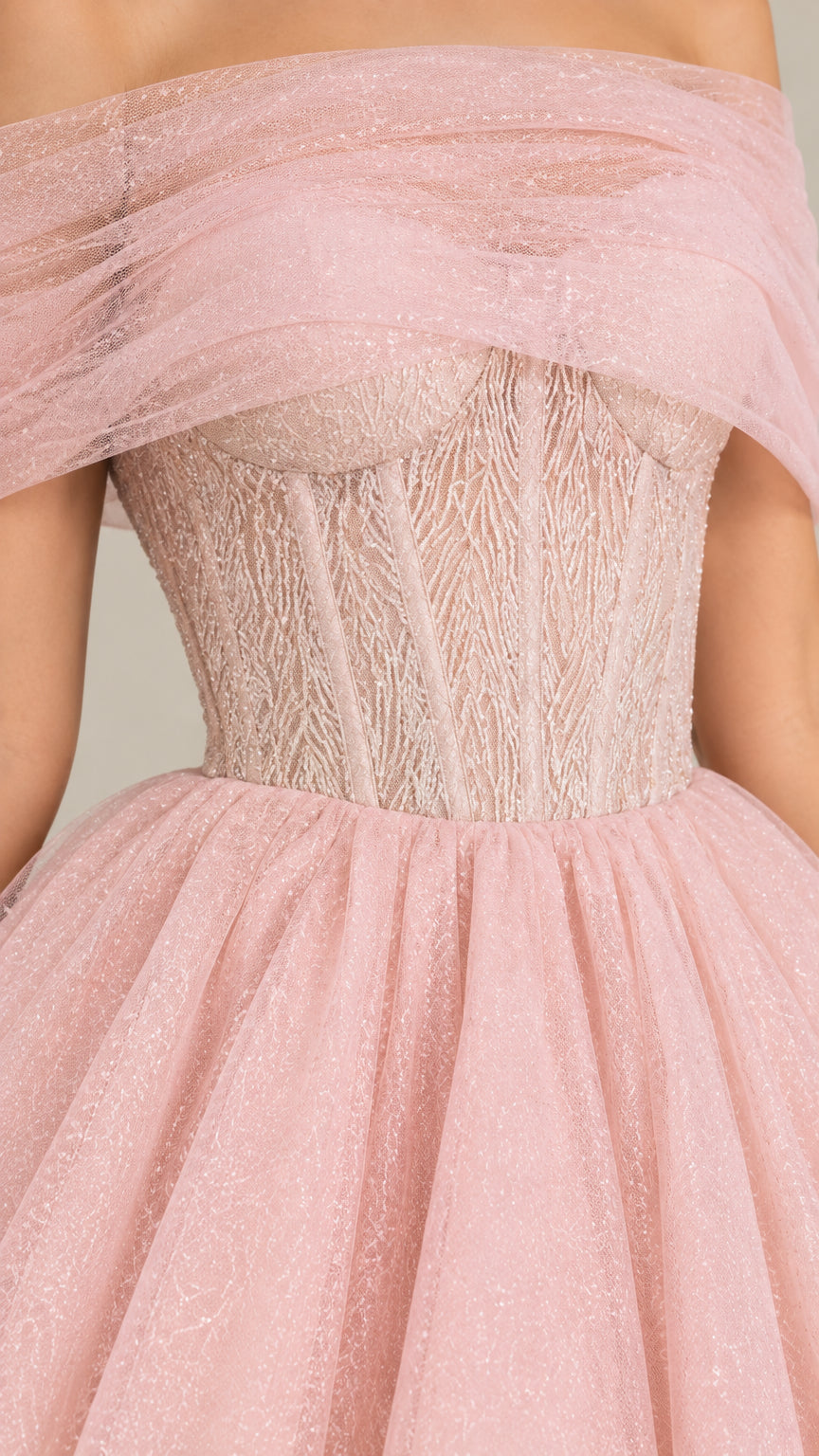 Close-up detail of textured boned corset bodice and draped tulle neckline