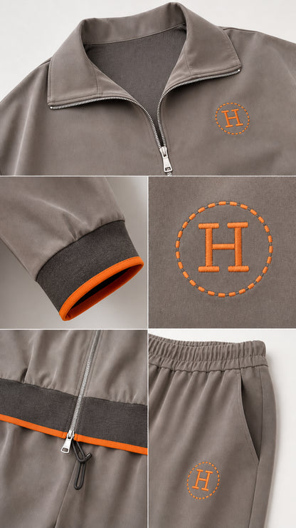Close-up details of collar zipper, contrast sleeve cuff, embroidered monogram logo, and elastic waistband