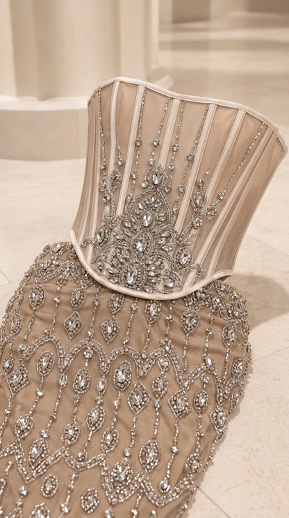 Close-up detail of sheer boned corset bodice and intricate crystal beading