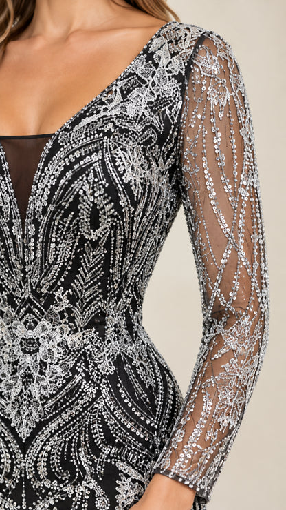Close-up detail of V-neckline mesh inset and intricate sequin sleeve craftsmanship