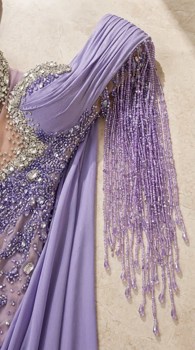 Close-up detail of shoulder beaded fringe tassels and crystal embellishments on lavender mesh