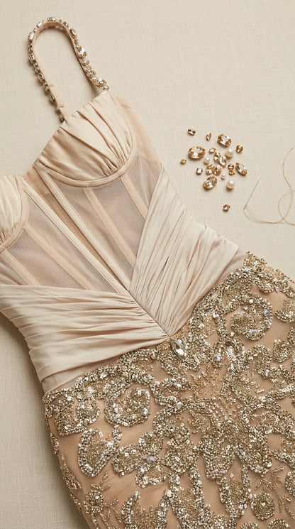 Close-up detail of champagne pleated corset bodice and beadwork