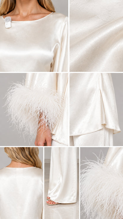 Close-up details of ivory satin fabric, boat neckline, and feather cuffs