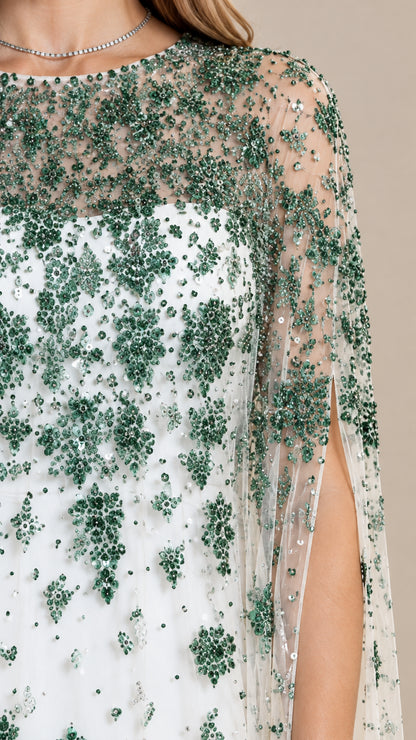 Close up of emerald green sequin embroidery on sheer neckline
