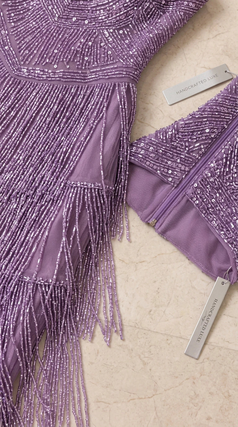 Close-up detail of sequin embroidery, beaded fringe, and back zipper lining
