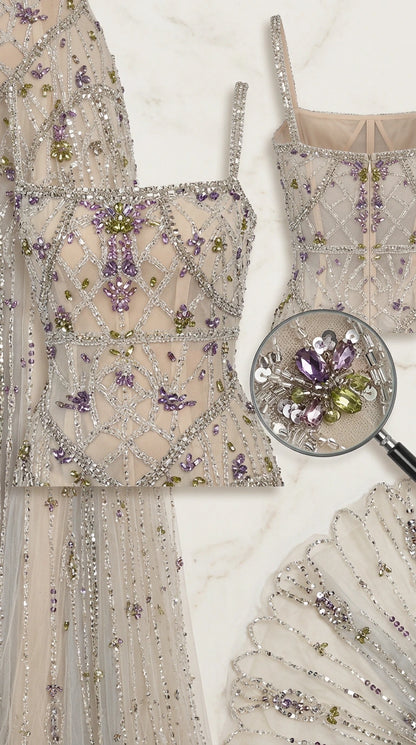 Close-up detail of intricate crystal beadwork and floral embroidery on bodice