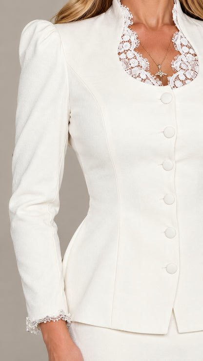 Close-up detail of white jacket neckline with lace trim and covered buttons