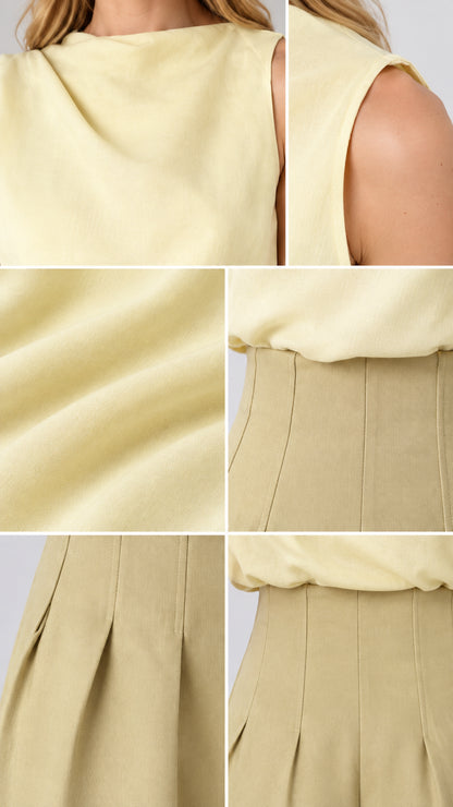 Close-up details of fabric texture, neckline drape, and waist pleats
