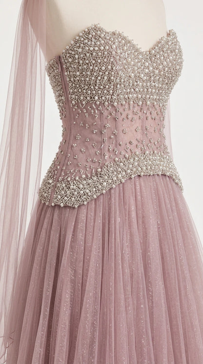 Close-up detail of heavily beaded sweetheart corset bodice with dropped basque waistline