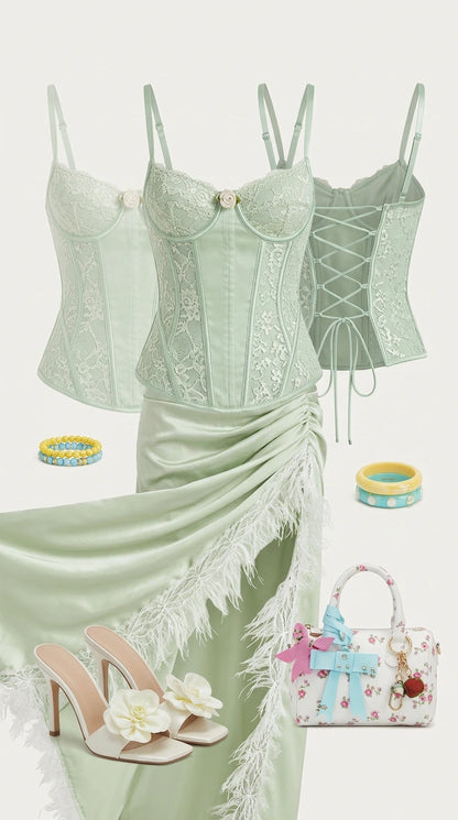 Flat lay outfit layout featuring sage green lace corset top and skirt with matching accessories