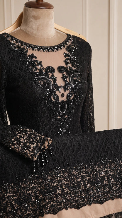 Close-up detail of sheer illusion neckline with intricate beading and sequin lace