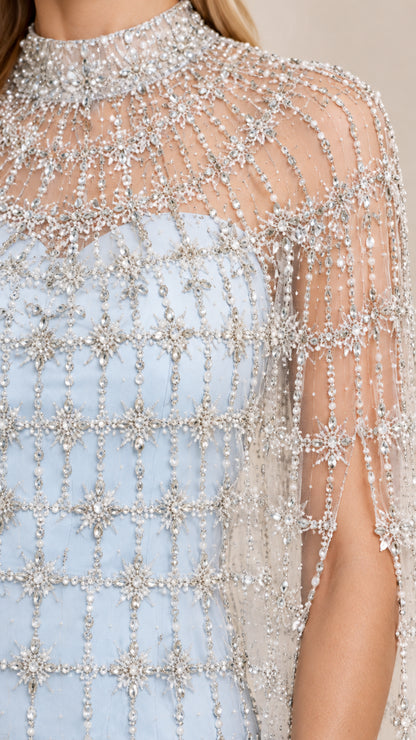 Close-up detail of sheer mock neck collar and intricate silver beading on sky blue gown