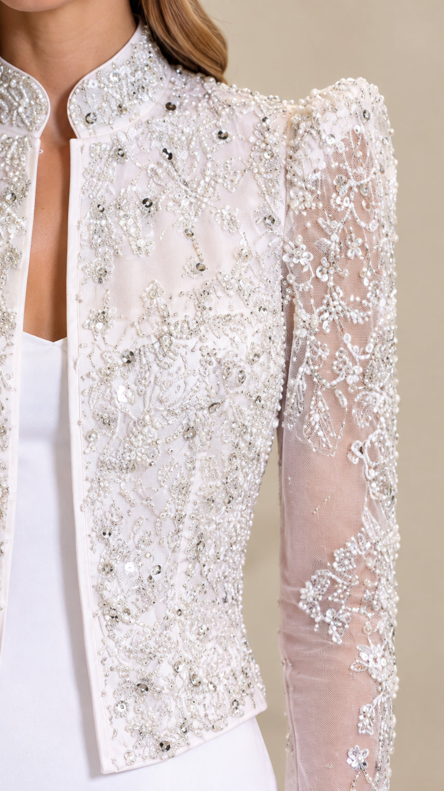 Close-up detail of beaded lace overlay and mandarin collar on formal jacket