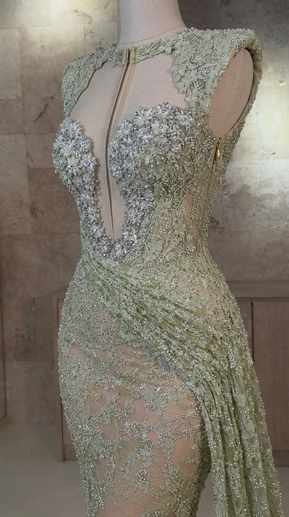Close-up detail of sheer illusion plunge bodice and crystal beadwork on sage green gown