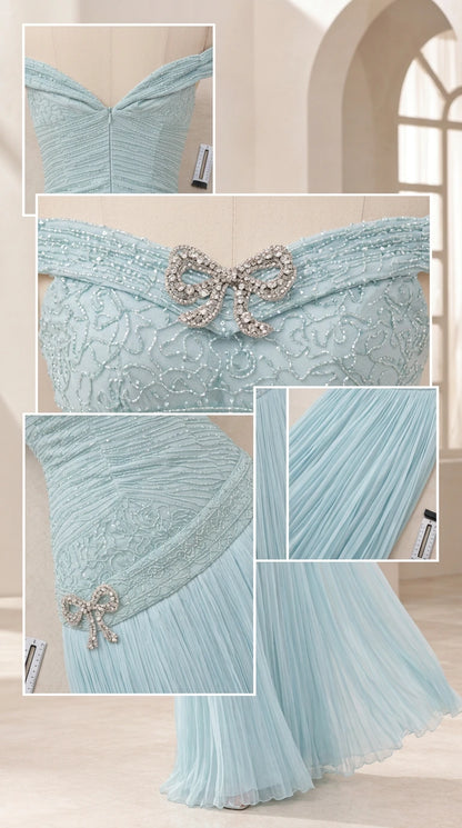 Close-up details of delicate rhinestone bow embellishments and fine pleating