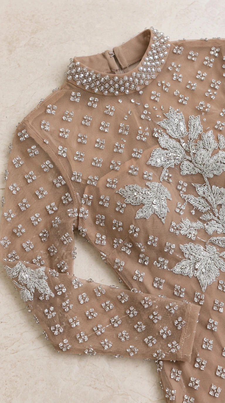 Close-up detail of high neckline, floral embroidery, and crystal beadwork