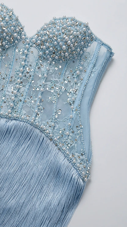 Close-up detail of the sheer mesh bodice with pearls, sequins, boning, and fringe attachment