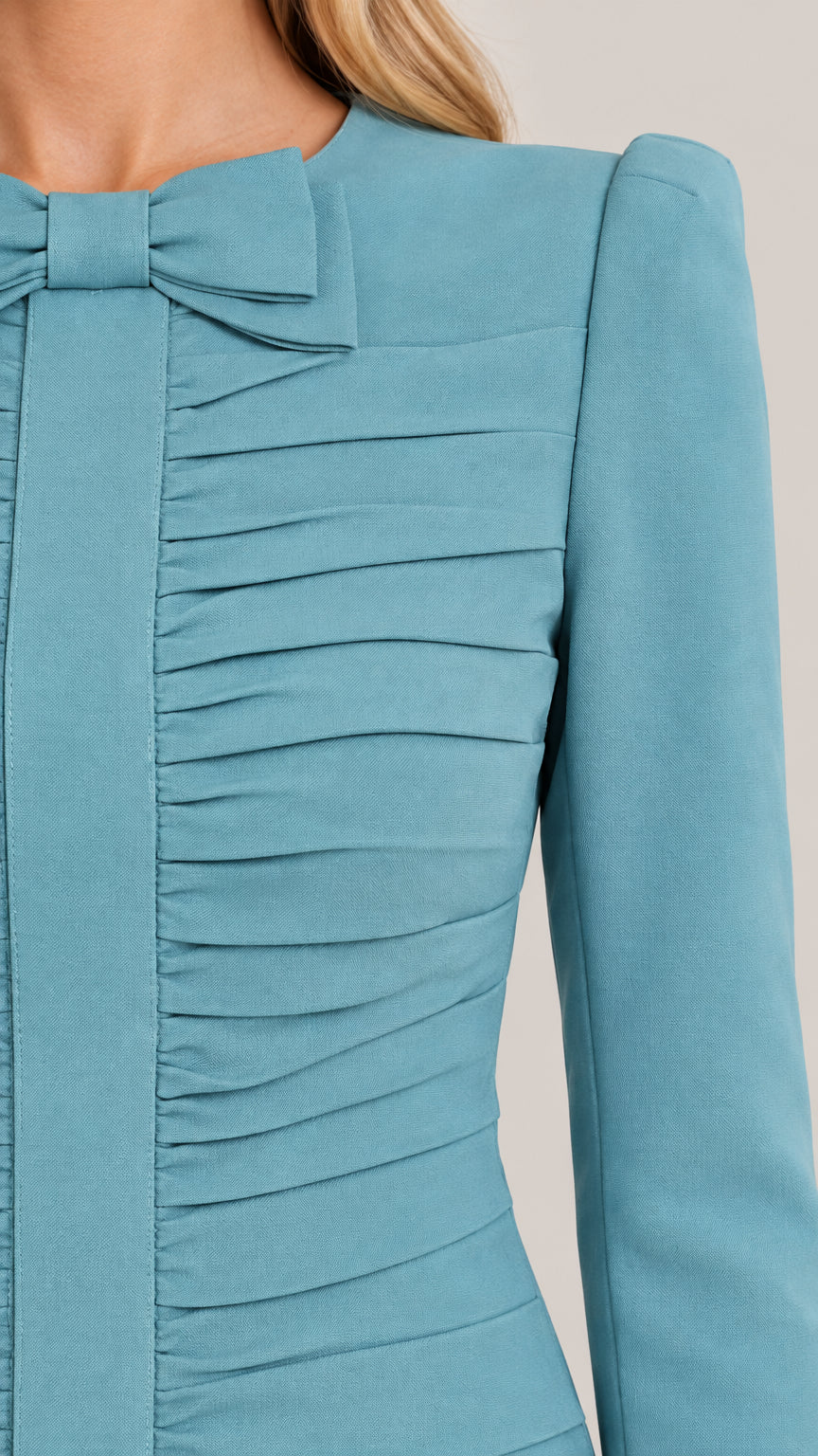 Close-up detail of Dusty Blue pleated ruching and bow accent on bodice