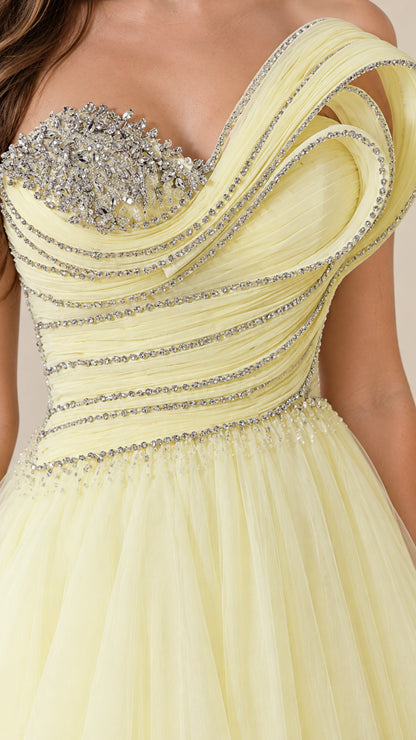 Close-up detail of the rhinestone-embellished sweetheart bodice and pleated shoulder