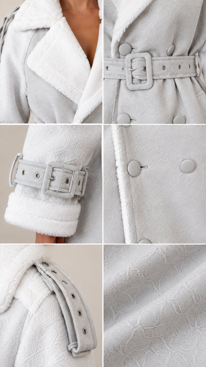 Close-up details of shearling lapels, buckled belt, and cuff hardware