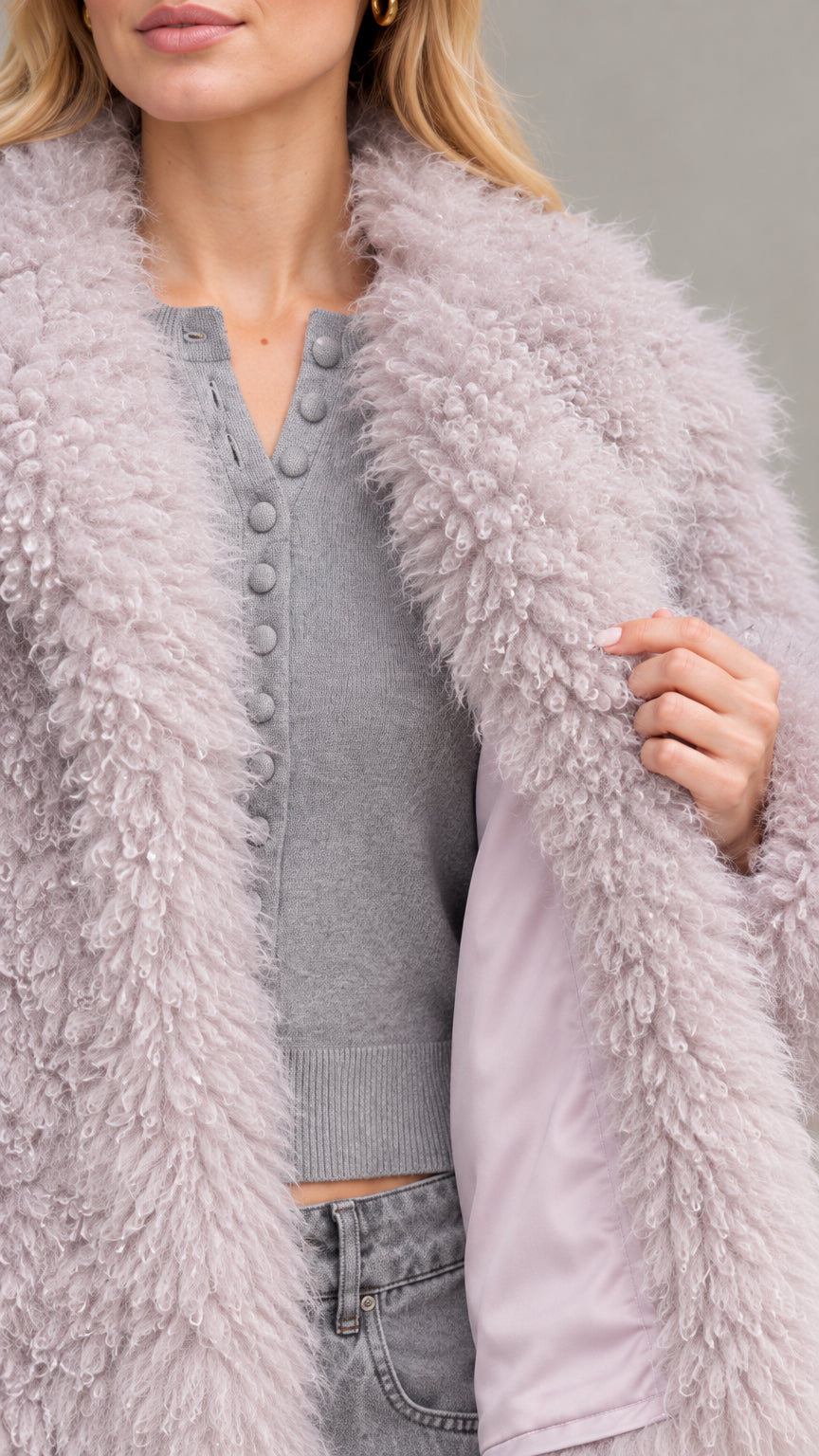 Close-up detail of dusty lilac textured curly faux fur and smooth interior lining
