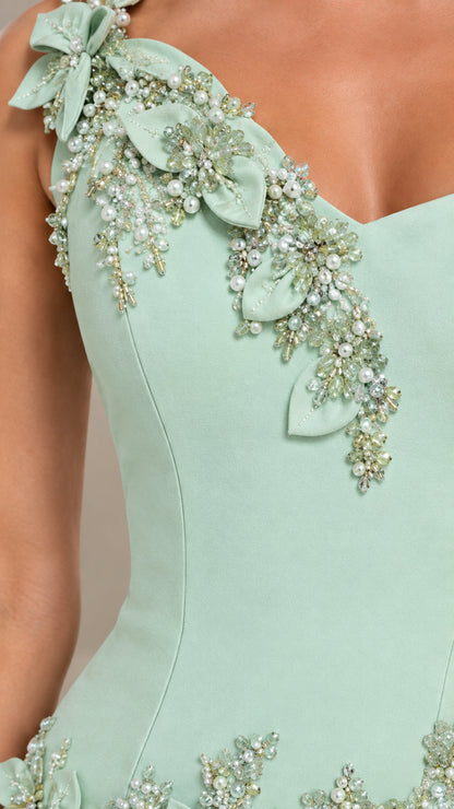 Close-up of beaded 3D floral appliqué detail on mint green gown neckline