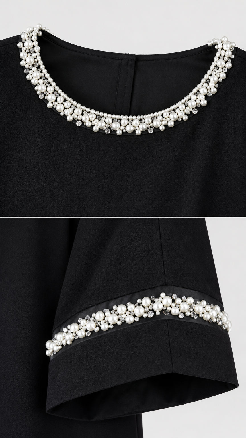 Close-up detail of pearl bead embellishments on neckline and sleeve cuff